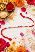 Sandalwood (Chandan) Beaded Rakhi with Red & Gold Beads