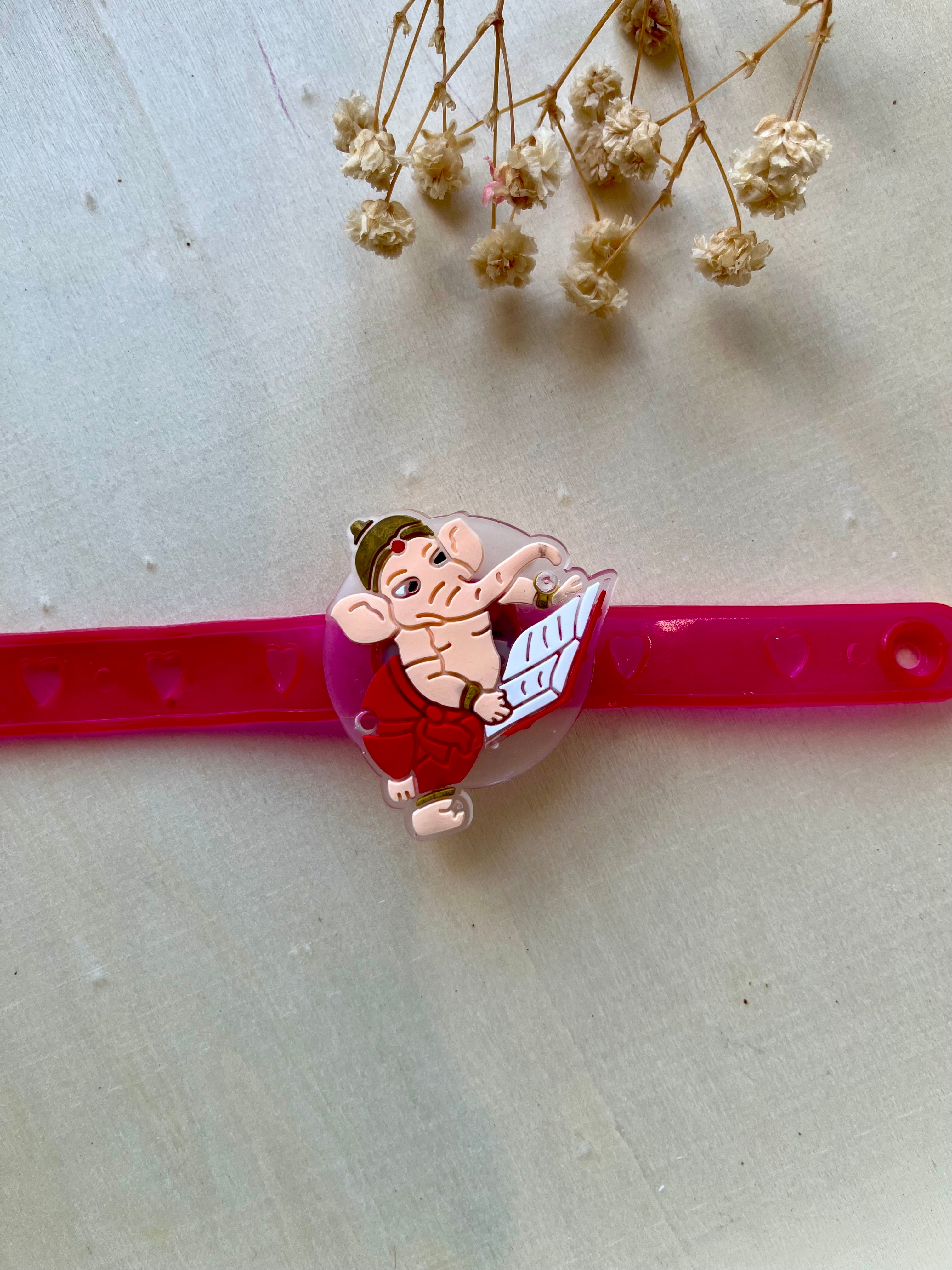 Baby Ganesha Light-Up Rakhi for Kids – Glowing Rubber Band Rakhi | Desi Luxe NZ